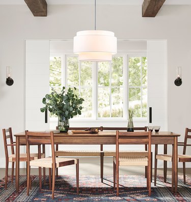 flush mount drum lighting for dining room with tiered linen shade above table