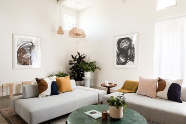 living room with neutral colors and concrete floors