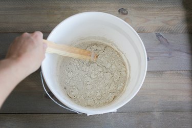 Stirring powdered lime into water