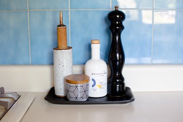 focus on salt and pepper shakers in kitchen with blue tile