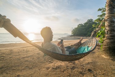 Texting from a hammock on the beach