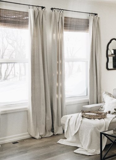 farmhouse DIY idea with no-sew drop cloth curtains in beige in white farmhouse living room
