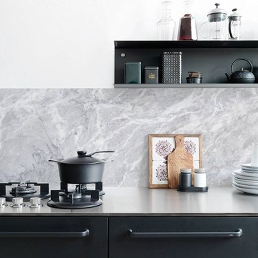 faux marble kitchen wallpaper backsplash idea with black cabinets