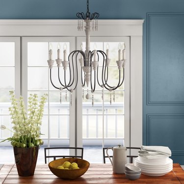 slim metal candelabra style chandelier with wood accents