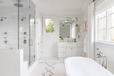 double rain showerhead in white bathroom
