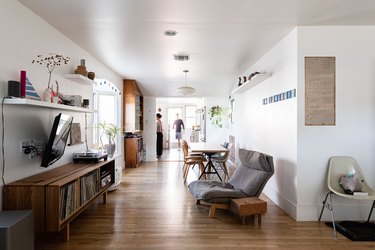 open living room with credenza, chairs, hardwood flooring