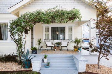 petite farmhouse porch idea with seating for two