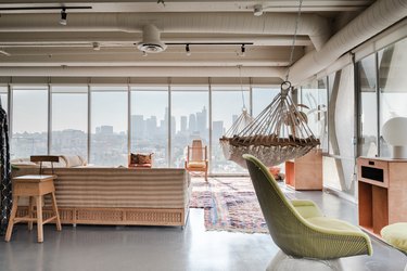 open loft with view of downtown, concrete floors, hammock