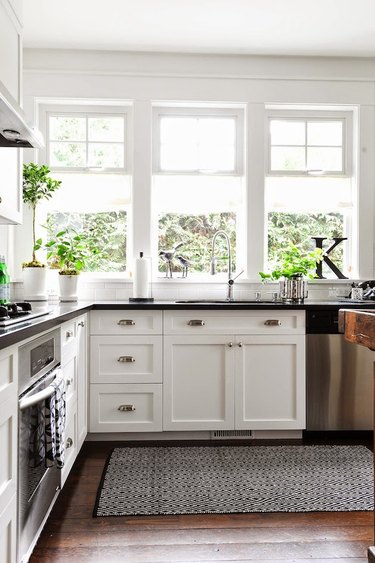 white Craftsman style kitchen with black countertops