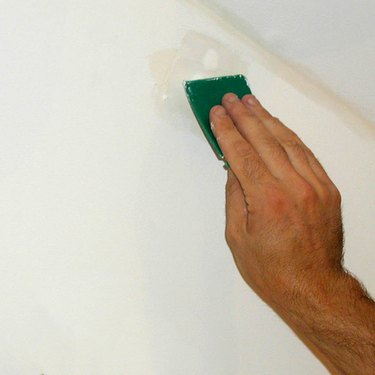 Sanding spackled wall