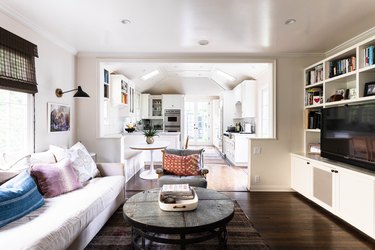 living room with entertainment center and white couch