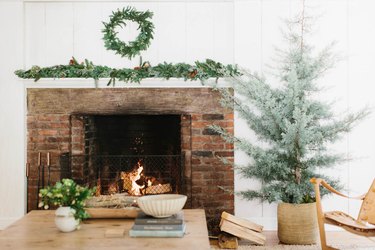 farmhouse Christmas tree idea with no decorations planted in woven basket