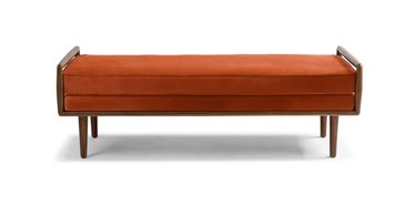 midcentury modern bench with walnut frame and orange velvet upholstery