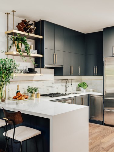 modern kitchen with mixed metal finishes and single-bowl sink