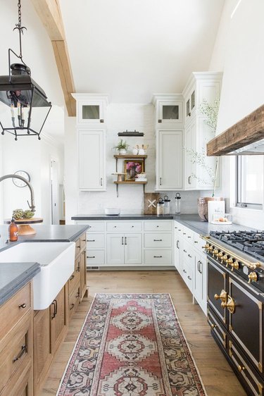 farmhouse kitchen with exposed beams and single bowl apron sink