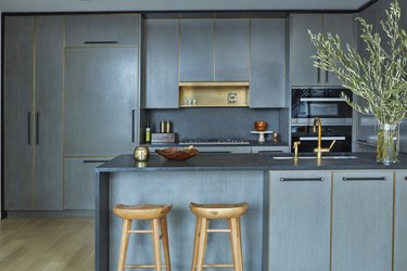 Blue Chelsea Kitchen with waterfall countertop by Jarret Yoshida