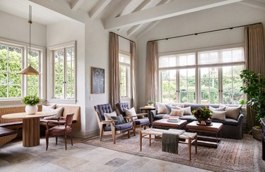 farmhouse flooring idea in living room with tumbled limestone floor