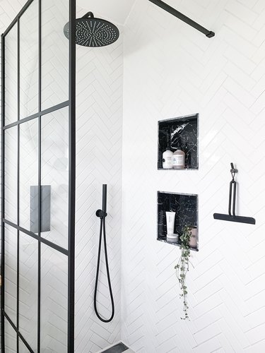 white tiles with black fixtures bathroom