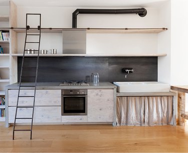 Kitchen with Concrete waterfall countertop by Katrin Arens