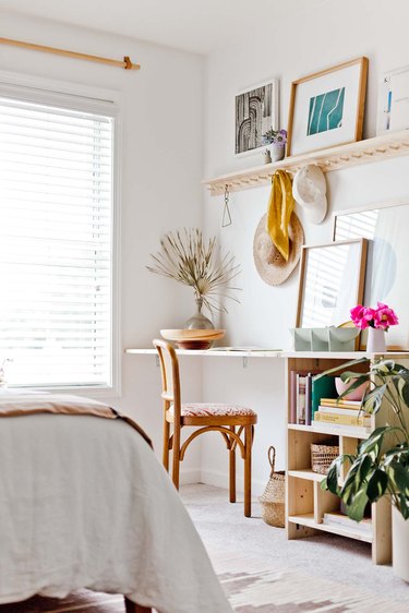 Boho office in light woods with palm frond and storage compartments