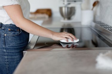 Hand cleaning stovetop