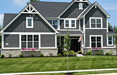 black craftsman style house with white trim