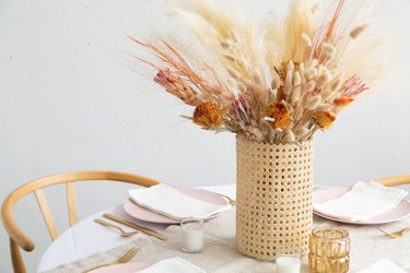 DIY Cane wrapped vase with dried grass centerpiece