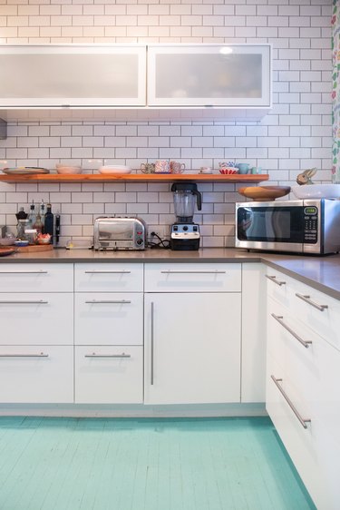 white kitchen with Tiffany blue floor