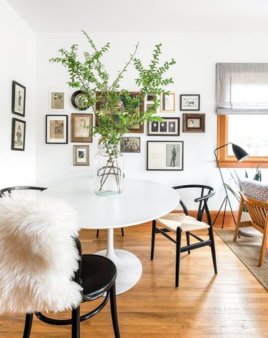 Dining room table and chairs with sheepskin