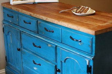 Distressed blue dresser with wood block countertop