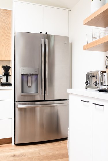 silver fridge in kitchen space