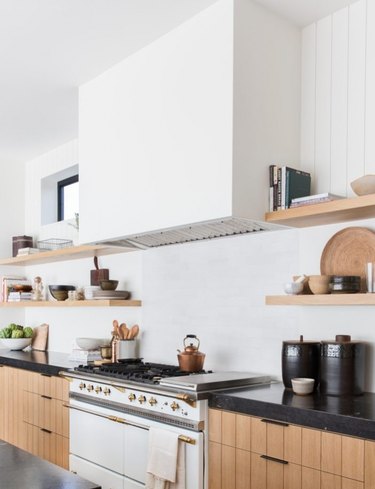 white kitchen with black countertops