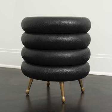 black stool with gold legs