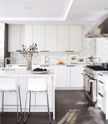 Kitchen with herringbone pattern stone tile backsplash