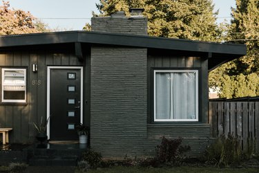 Gray painted home with black door