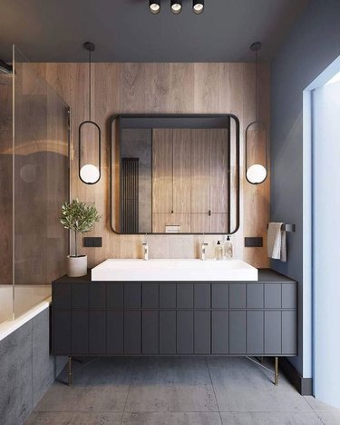 pendant lighting bathroom idea for black and brown bathroom with large mirror and hanging pendants