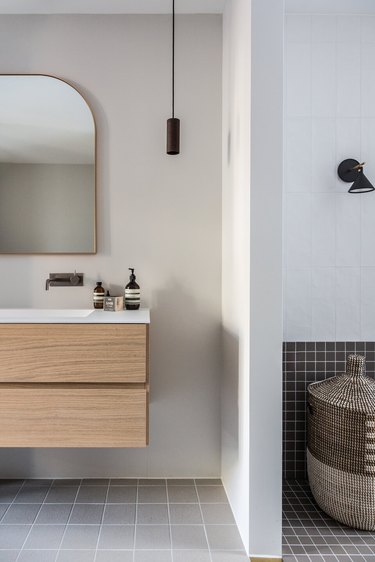 pendant lighting bathroom idea for gray bathroom with black pendant light and floating vanity