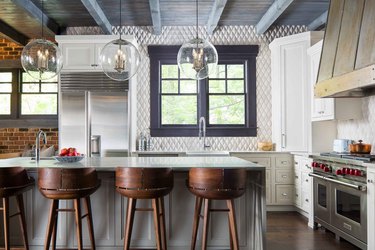 Kitchen with geometric stone tile backsplash