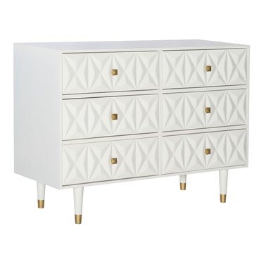 Hollywood Regency furniture dresser with geometric details and brass pulls in a white finish