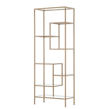 Hollywood Regency furniture bookcase with geometric brass details