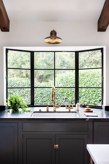 white kitchen with black counters and cabinets