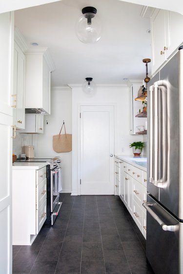 Black vinyl modern kitchen flooring in white contemporary kitchen