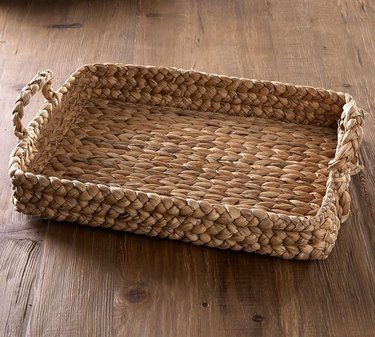 Woven decorative tray/basket with two handles