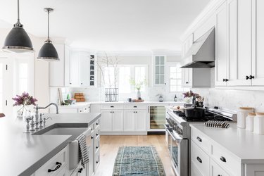 bright open concept kitchen with white walls