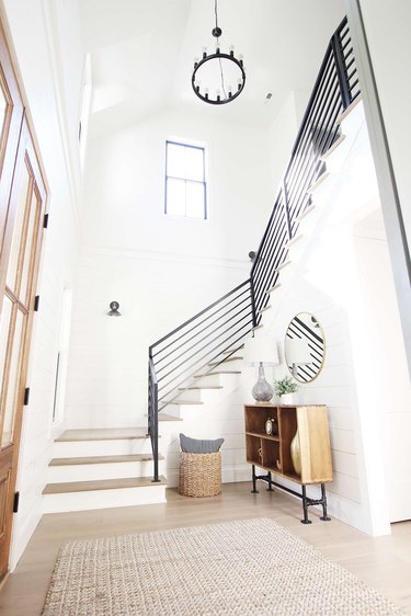 Art Deco staircase with linear railings in modern farmhouse home