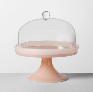 pink cake stand with cloche