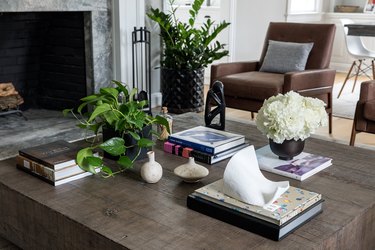 living room wooden coffee table and green accents