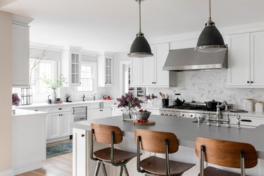 stainless steel kitchen and wooden chairs in kitchen