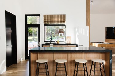 modern kitchen with black countertop island