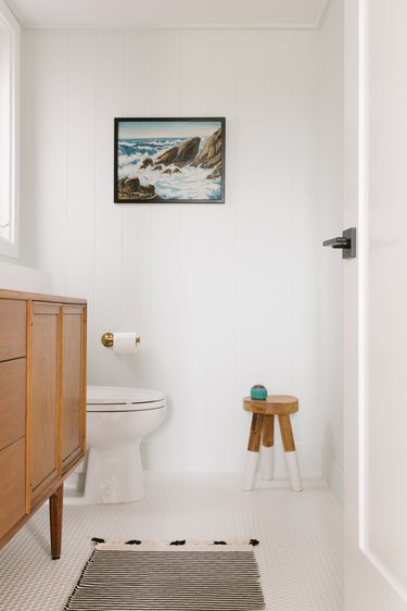 Bathroom with vintage artwork